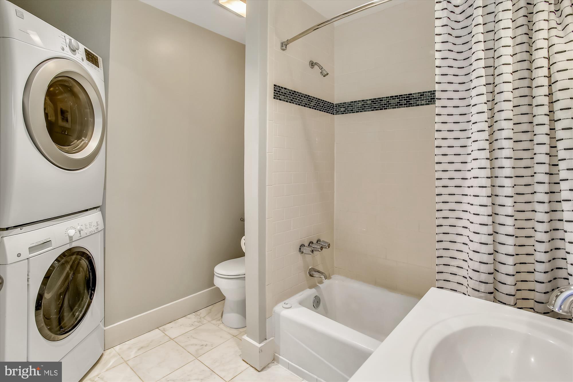 1726 U Street Northwest, Unit 3 Washington, DC 20009 - Photo 20 of 31 Primary Bathroom with in unit Laundry