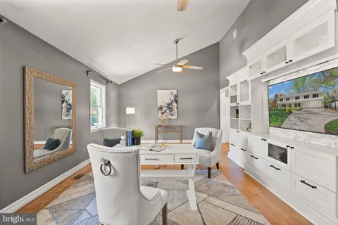 a spacious bathroom with a double vanity sink a large mirror and a window