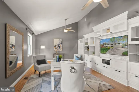 a spacious bathroom with a toilet a sink and a mirror