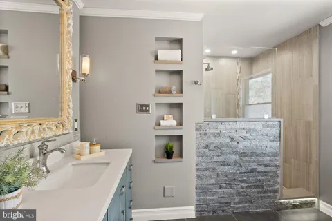 a view of a hallway with entryway wooden floor and front door