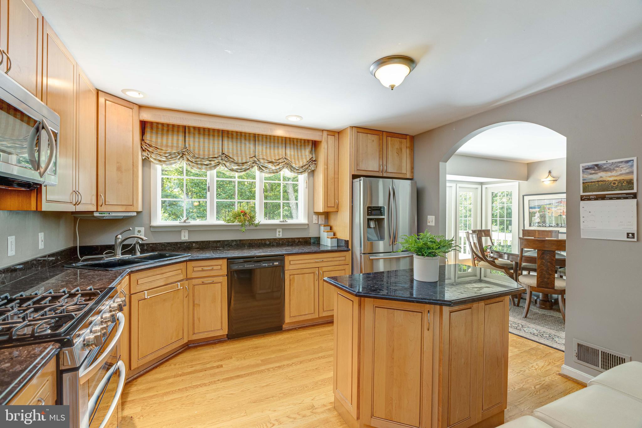 2408 Old Trace Lane Reston, VA 20191 - Photo 12 of 45 Kitchen opening to dining room and living room