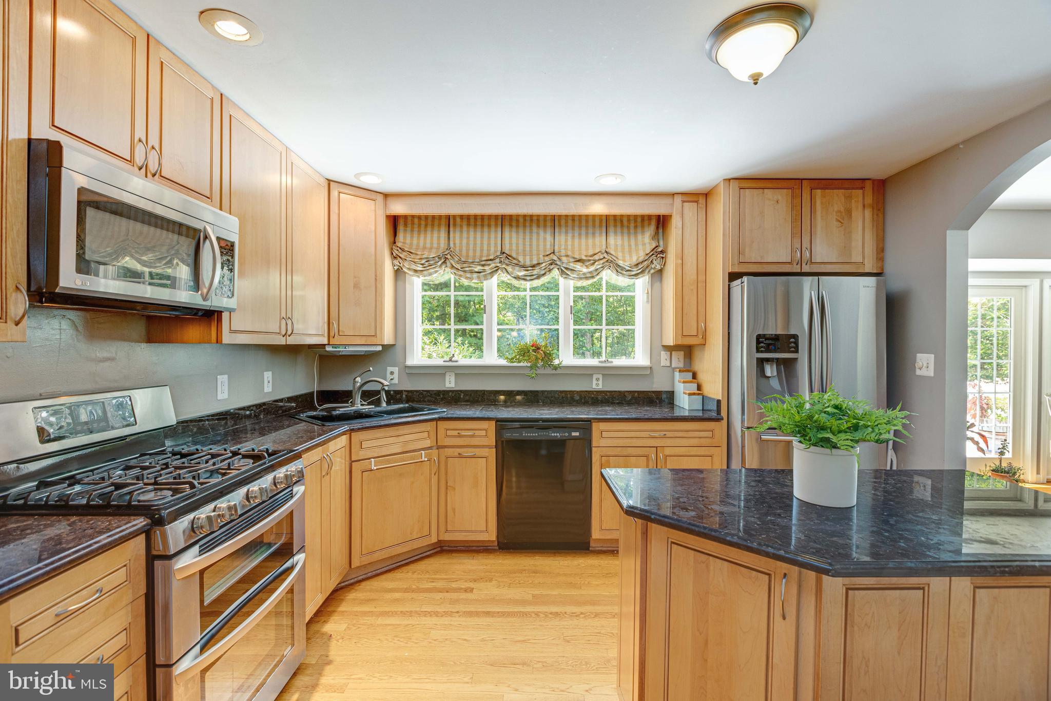 2408 Old Trace Lane Reston, VA 20191 - Photo 13 of 45 Kitchen opening to dining room and living room