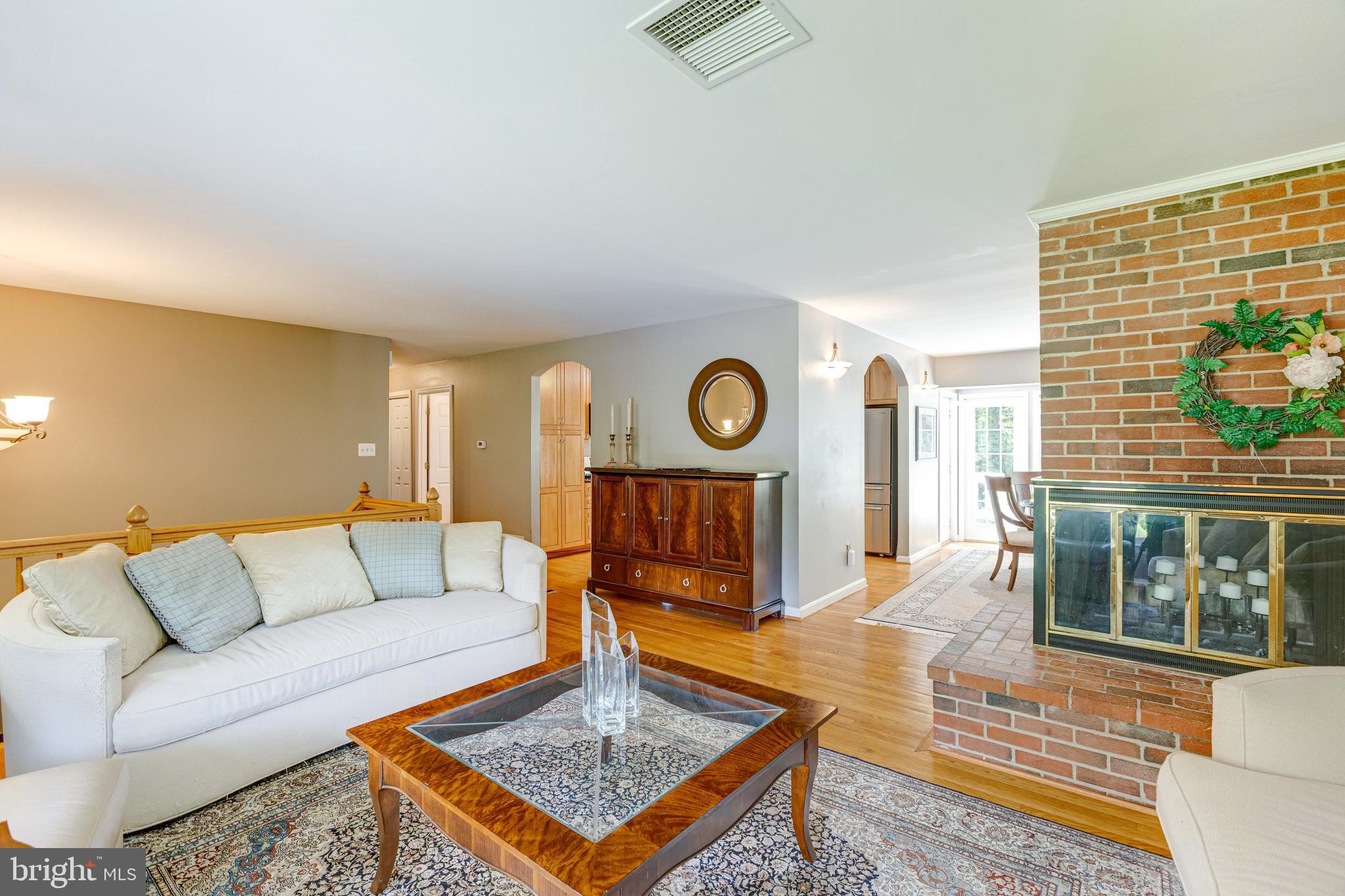 2408 Old Trace Lane Reston, VA 20191 - Photo 9 of 45 Living room with natural light and hardwood floor