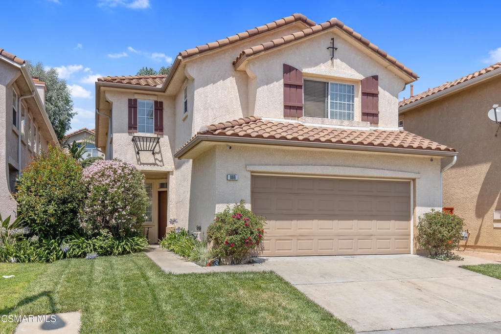 869 Aloe Lane Simi Valley, CA 93065 - Photo 1 of 31 a front view of a house with a yard and garage