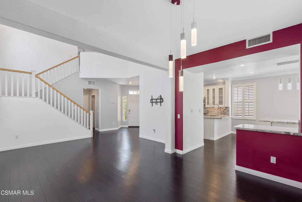869 Aloe Lane Simi Valley, CA 93065 - Photo 13 of 31 a view of an empty room with wooden floor and a bathroom