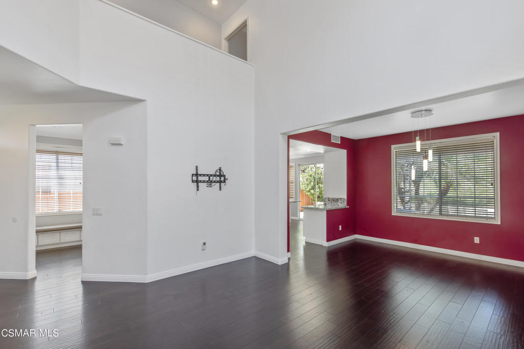 869 Aloe Lane Simi Valley, CA 93065 - Photo 15 of 31 an empty room with wooden floor and windows