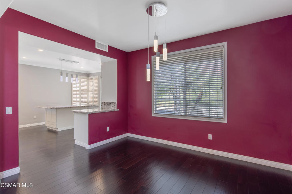 869 Aloe Lane Simi Valley, CA 93065 - Photo 16 of 31 a view of an empty room with wooden floor and a window