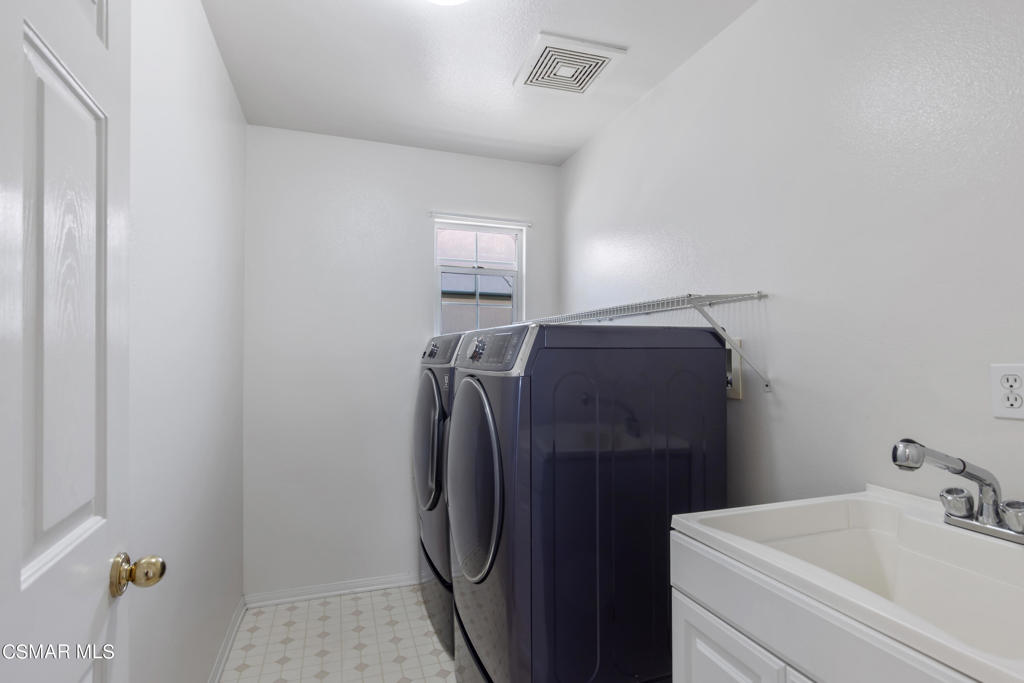 869 Aloe Lane Simi Valley, CA 93065 - Photo 18 of 31 a utility room with dryer and washer