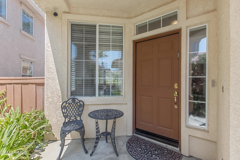 869 Aloe Lane Simi Valley, CA 93065 - Photo 2 of 31 a view of house with chair and table in the porch