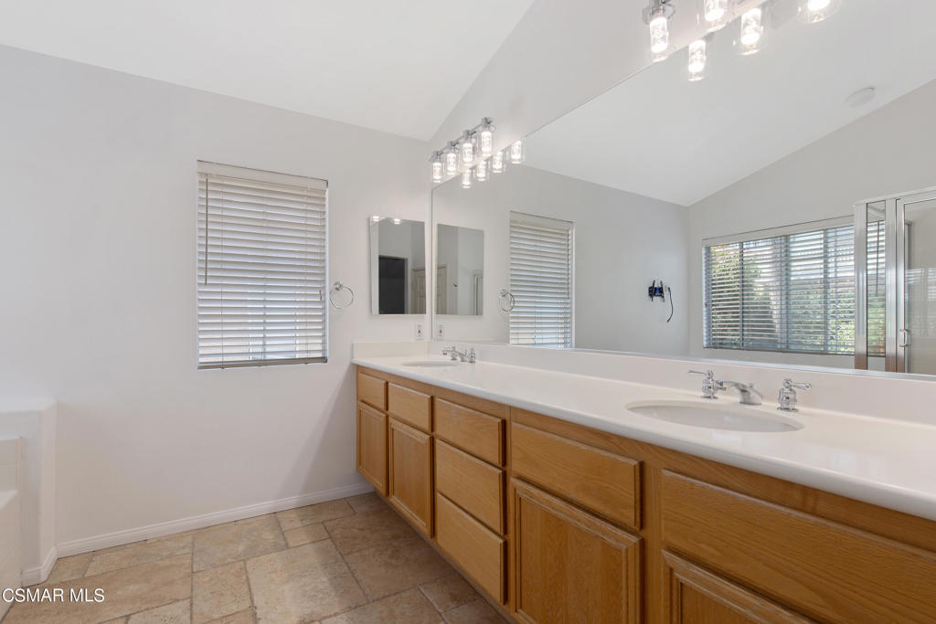 869 Aloe Lane Simi Valley, CA 93065 - Photo 26 of 31 a bathroom with a sink double vanity and a mirror