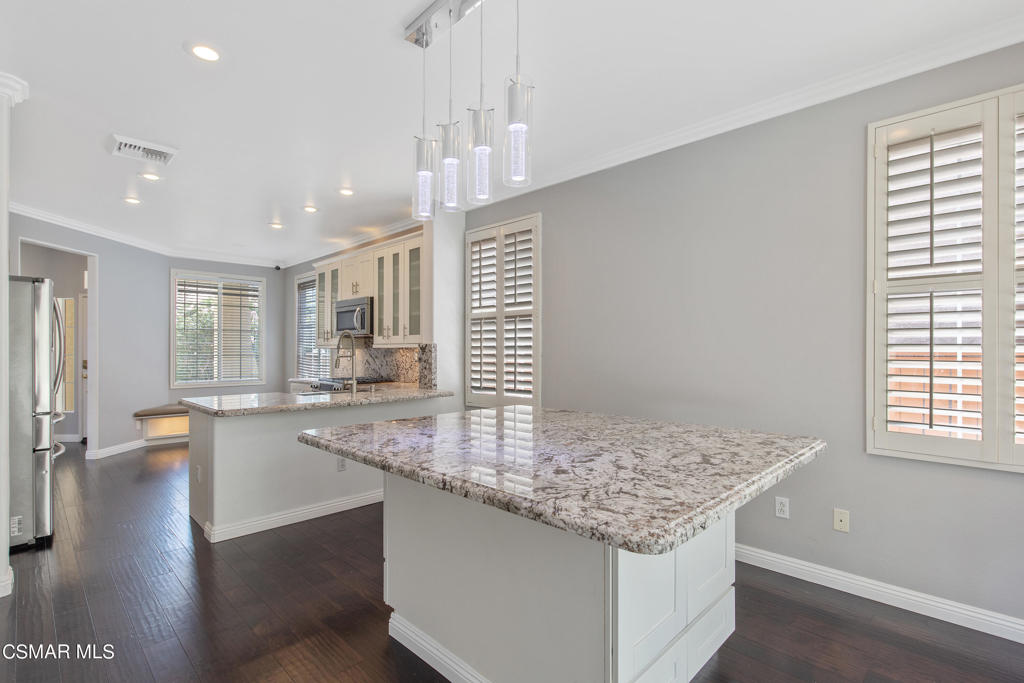 869 Aloe Lane Simi Valley, CA 93065 - Photo 7 of 31 a kitchen with center island and living room