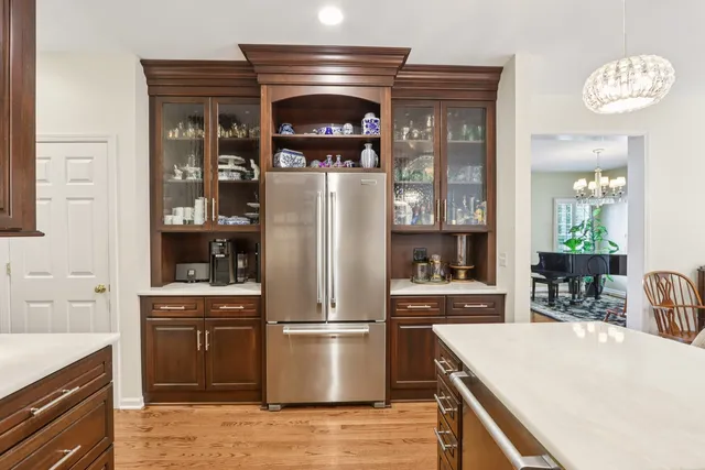 a kitchen with a refrigerator and a sink