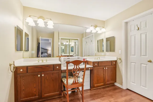 a spacious bathroom with a granite countertop sink and a mirror