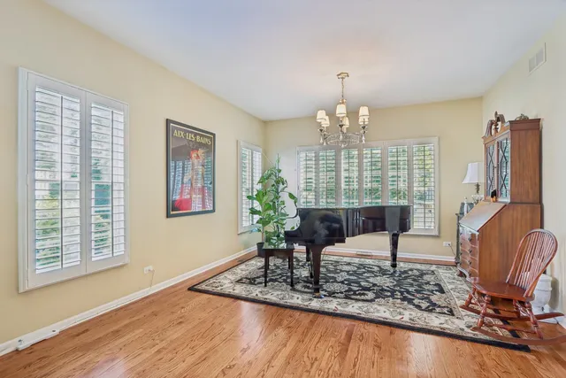 a view of a livingroom with furniture window and wooden floor