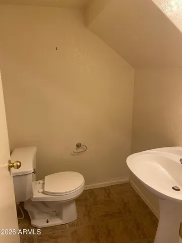 a bathroom with a toilet and a sink