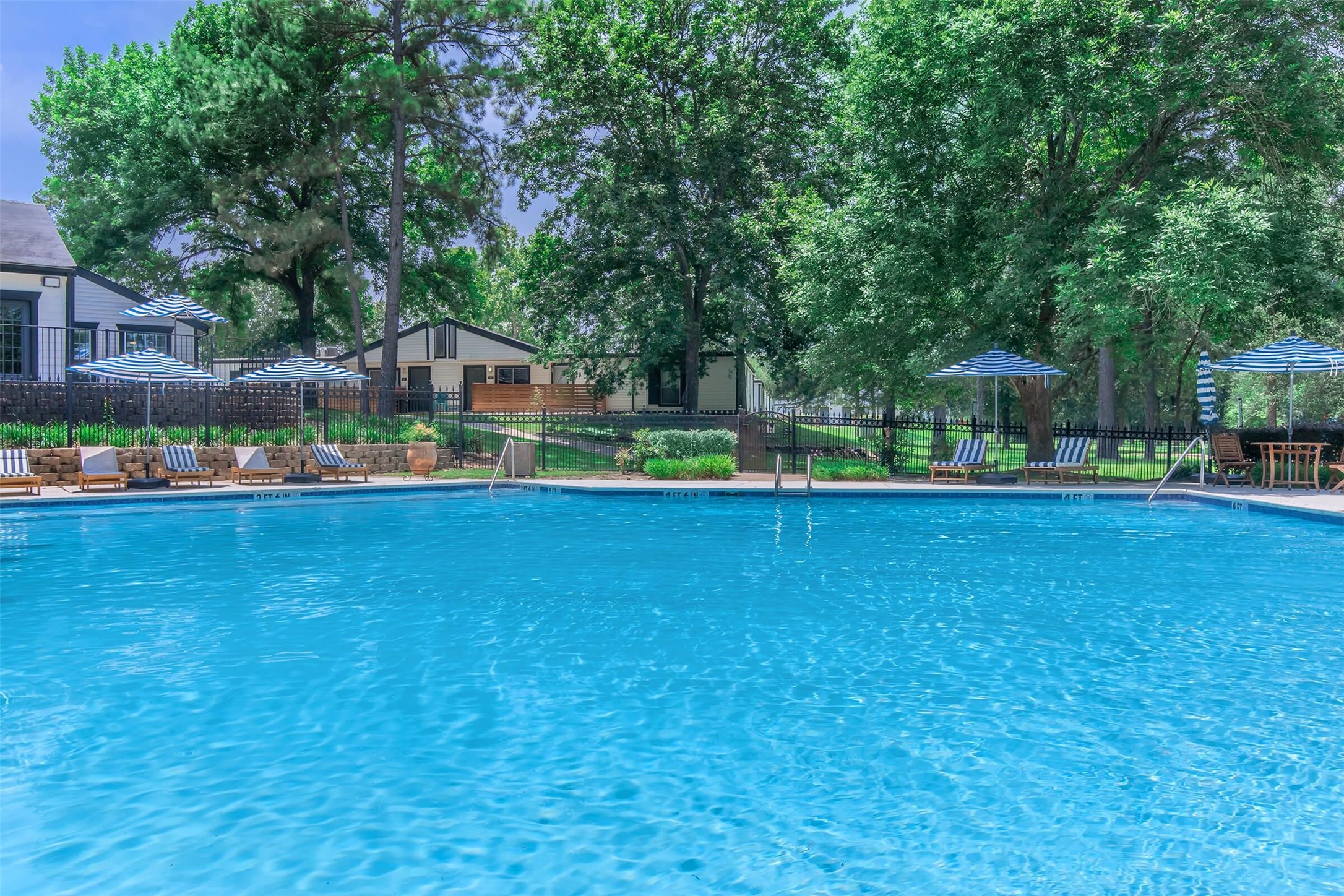 18001 Cypress Trace Road, Unit 1103 Houston, TX 77090 - Photo 30 of 32 a house view with swimming pool in front of it