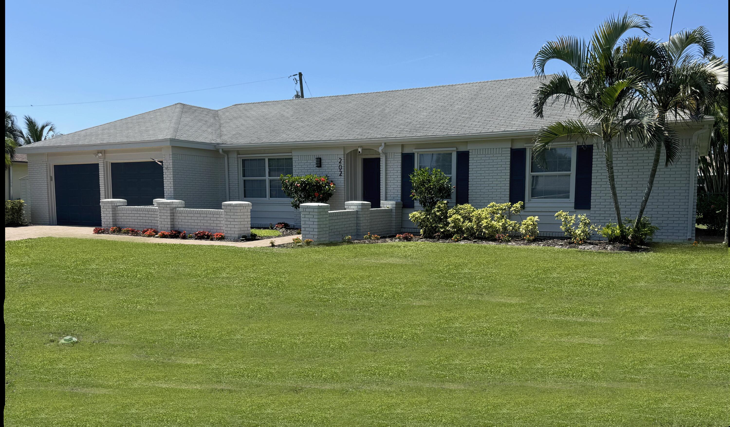 202 Windsor Road West Jupiter, FL 33469 - Photo 1 of 27 Front
