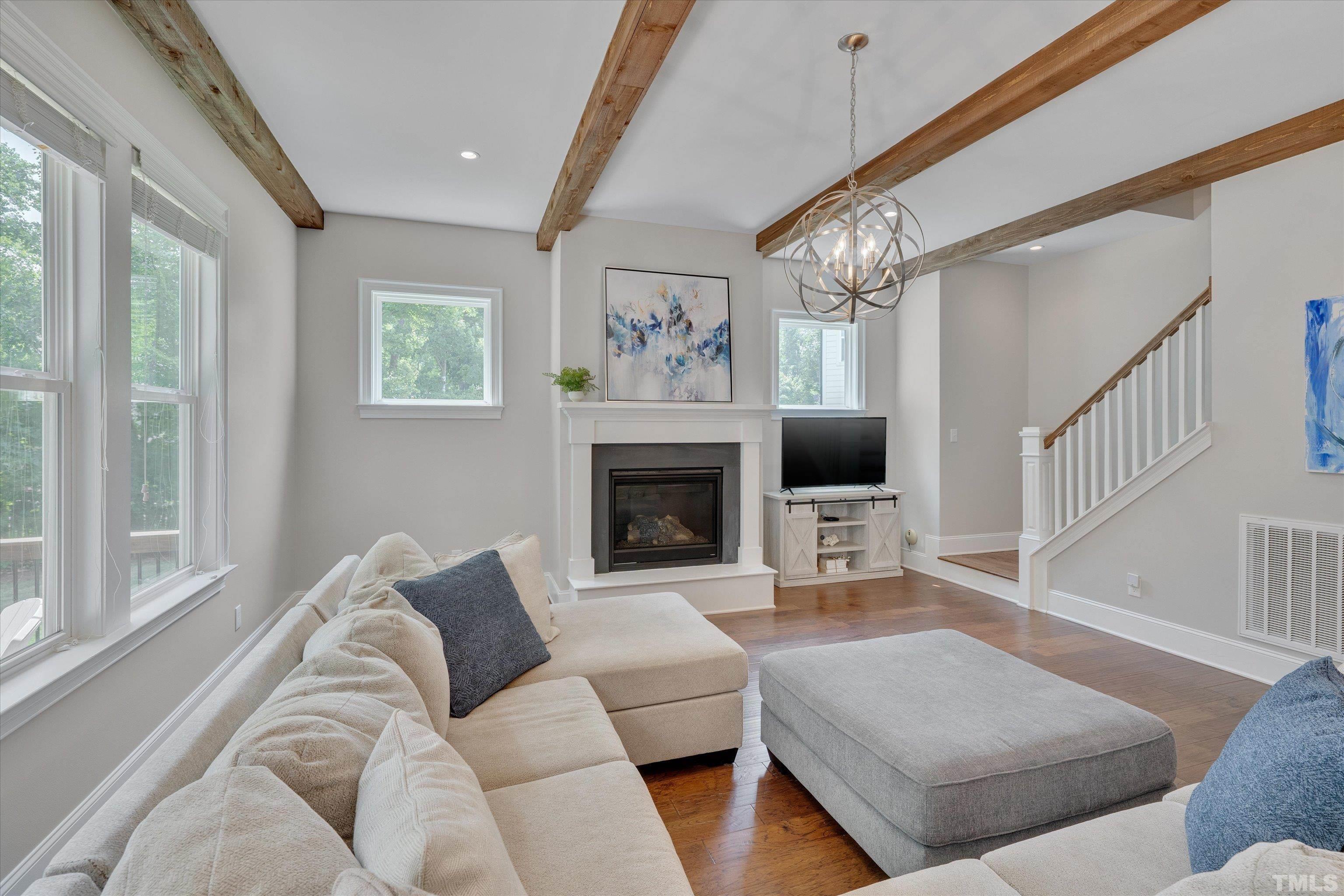 8012 Shree Court Raleigh, NC 27613 - Photo 17 of 49 a living room with furniture and a fireplace