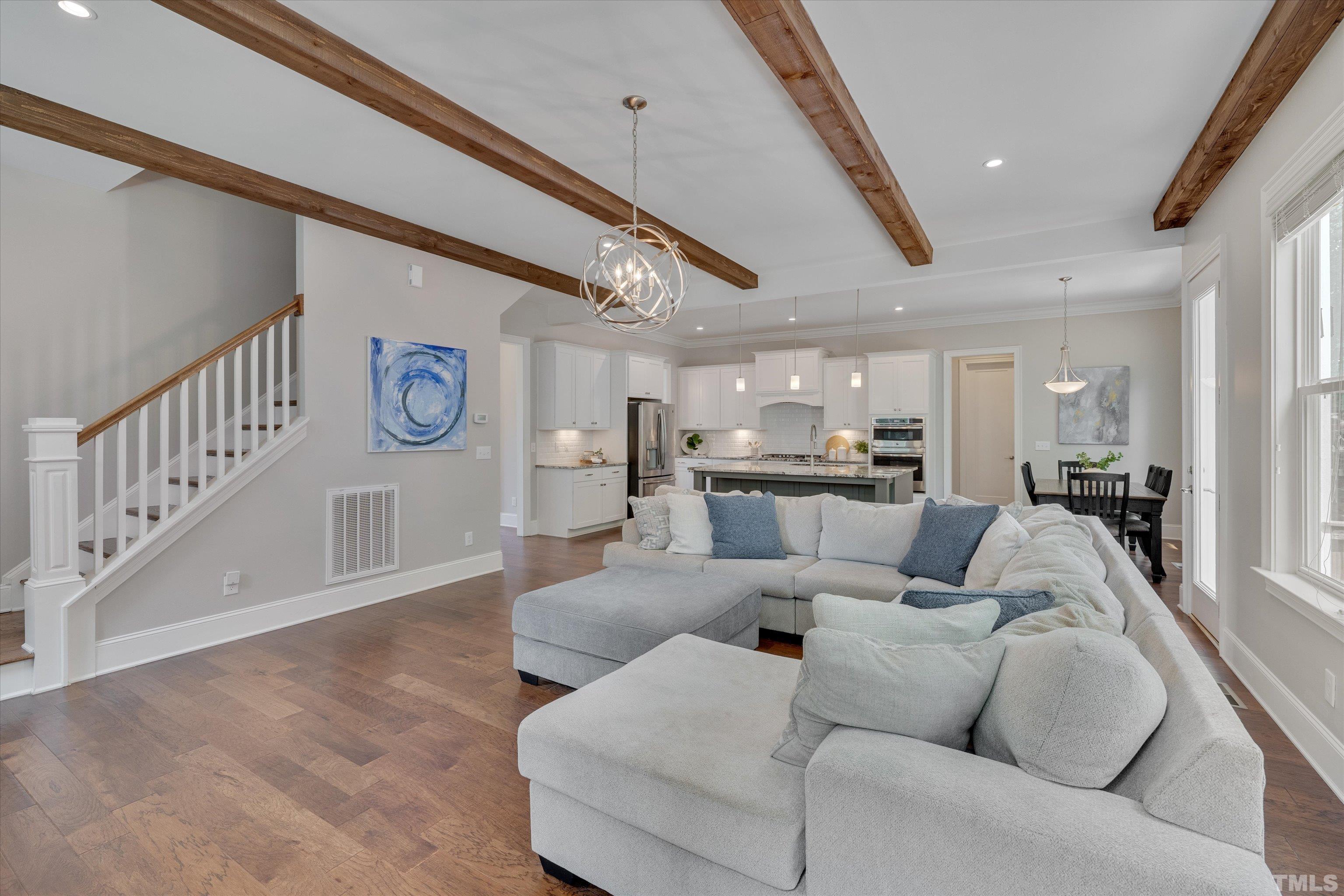 8012 Shree Court Raleigh, NC 27613 - Photo 19 of 49 a living room with furniture and a wooden floor