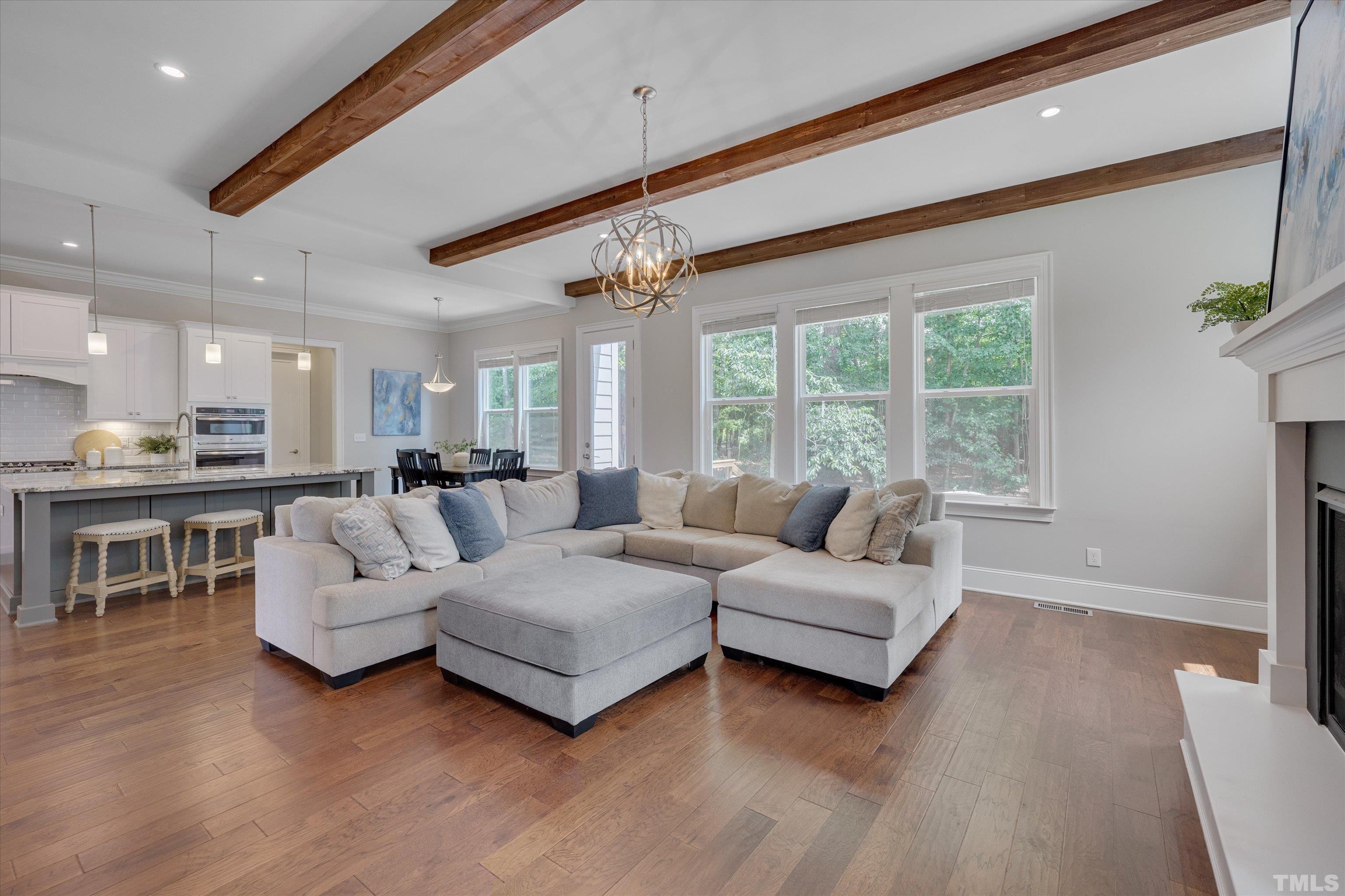 8012 Shree Court Raleigh, NC 27613 - Photo 20 of 49 a living room with furniture and a large window