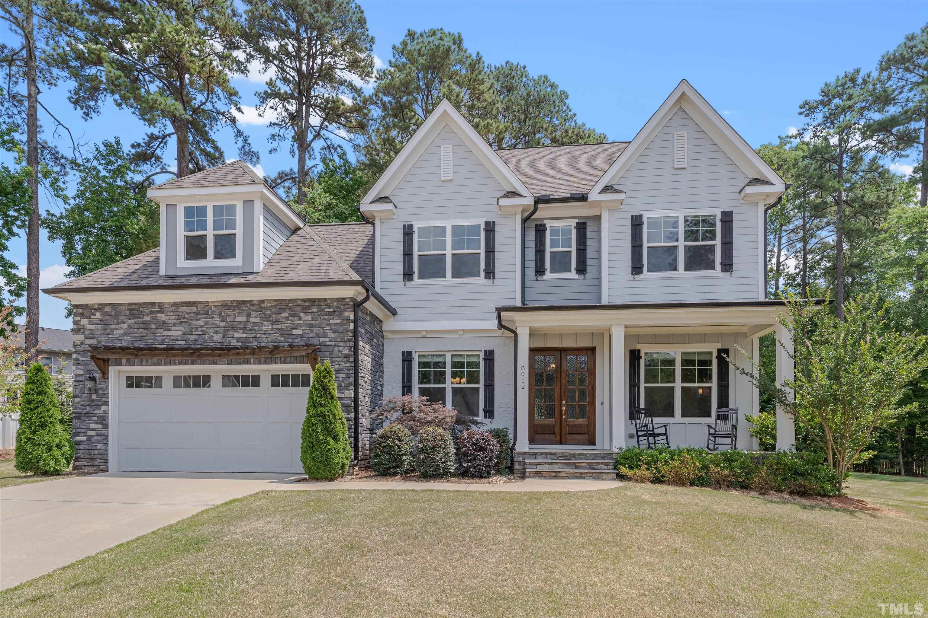 8012 Shree Court Raleigh, NC 27613 - Photo 2 of 49 a front view of a house with a garden and yard
