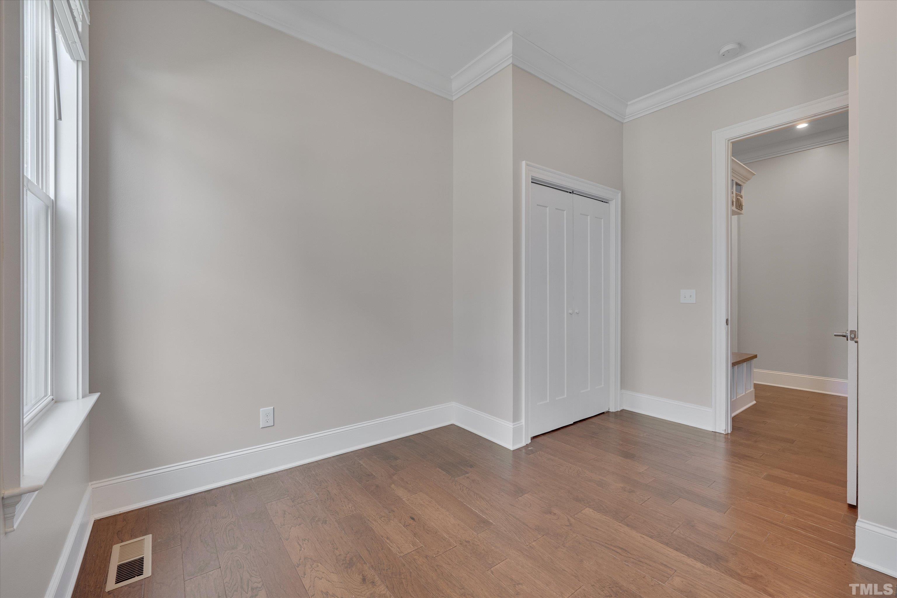 8012 Shree Court Raleigh, NC 27613 - Photo 25 of 49 an empty room with wooden floor