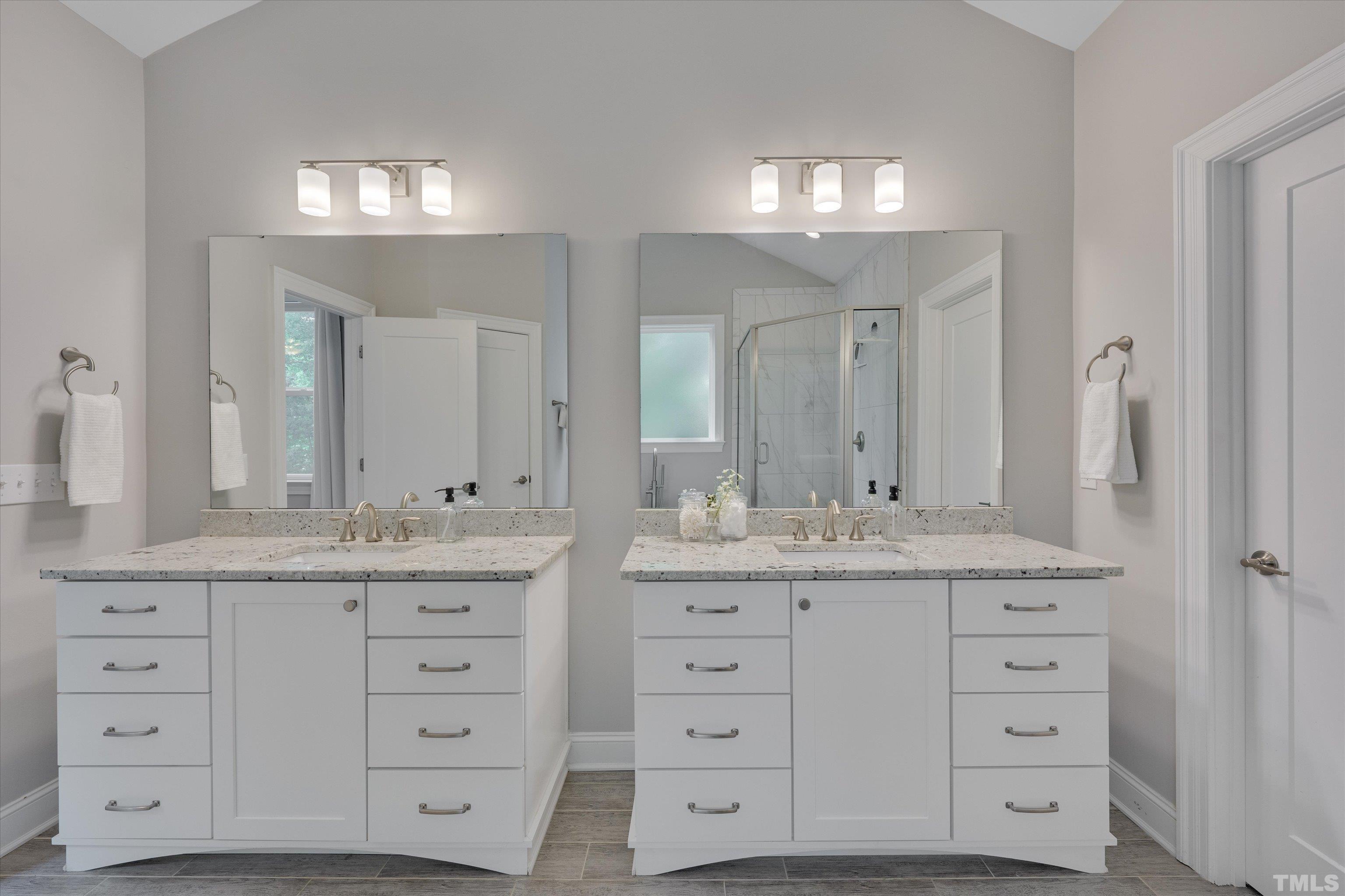 8012 Shree Court Raleigh, NC 27613 - Photo 31 of 49 a bathroom with a granite countertop sink vanity a mirror and a