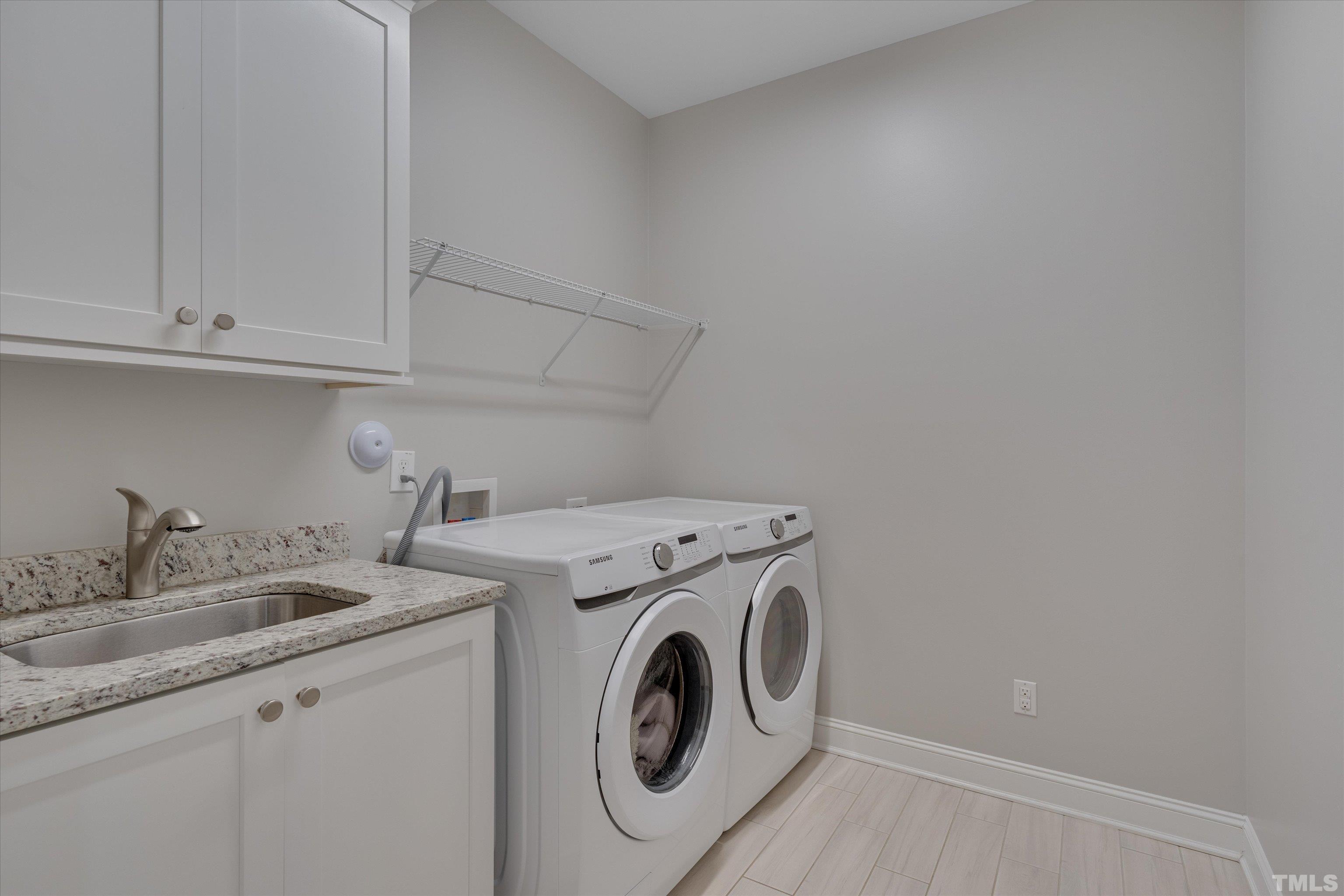 8012 Shree Court Raleigh, NC 27613 - Photo 40 of 49 a utility room with dryer and washer