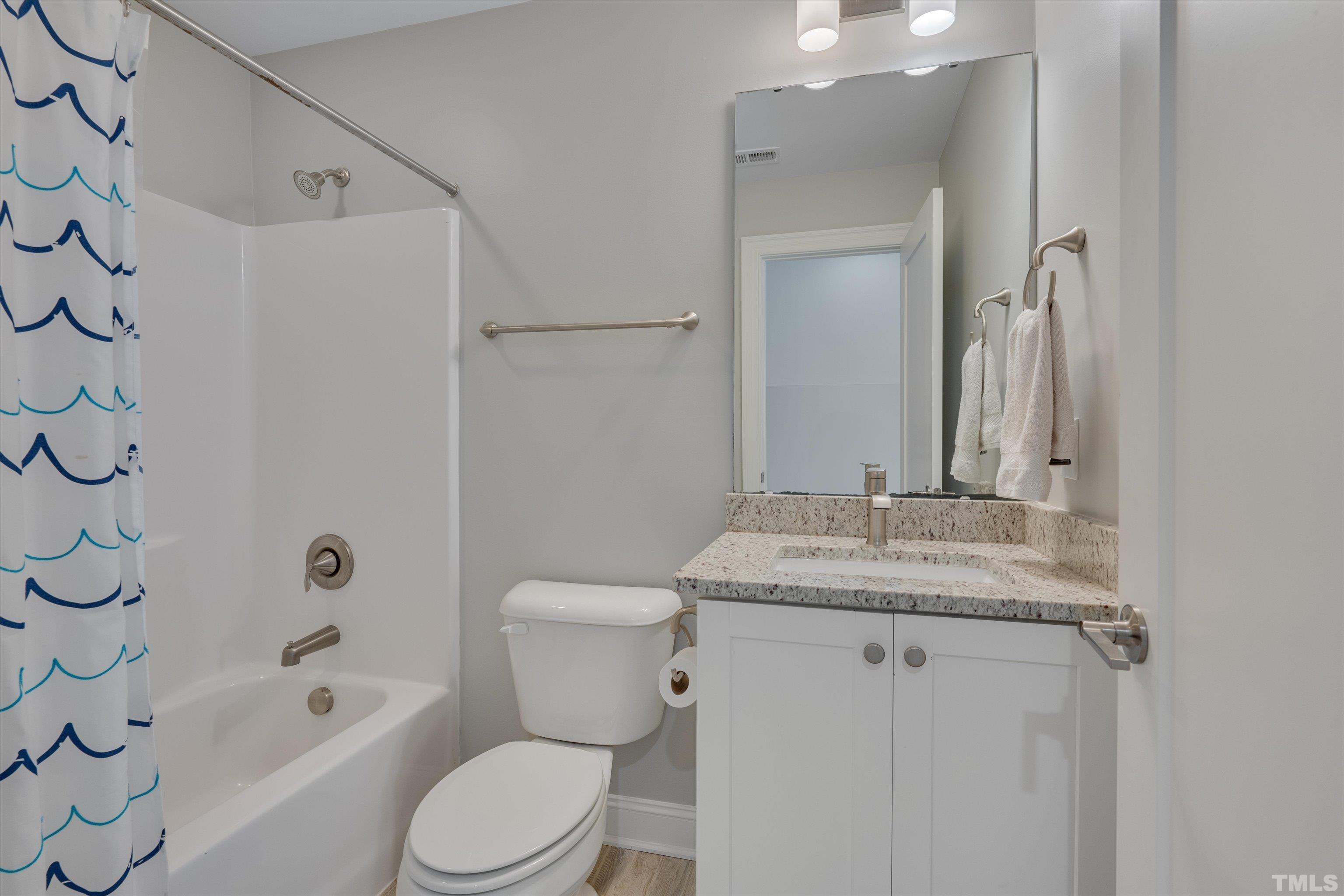 8012 Shree Court Raleigh, NC 27613 - Photo 43 of 49 a bathroom with a granite countertop sink toilet and shower