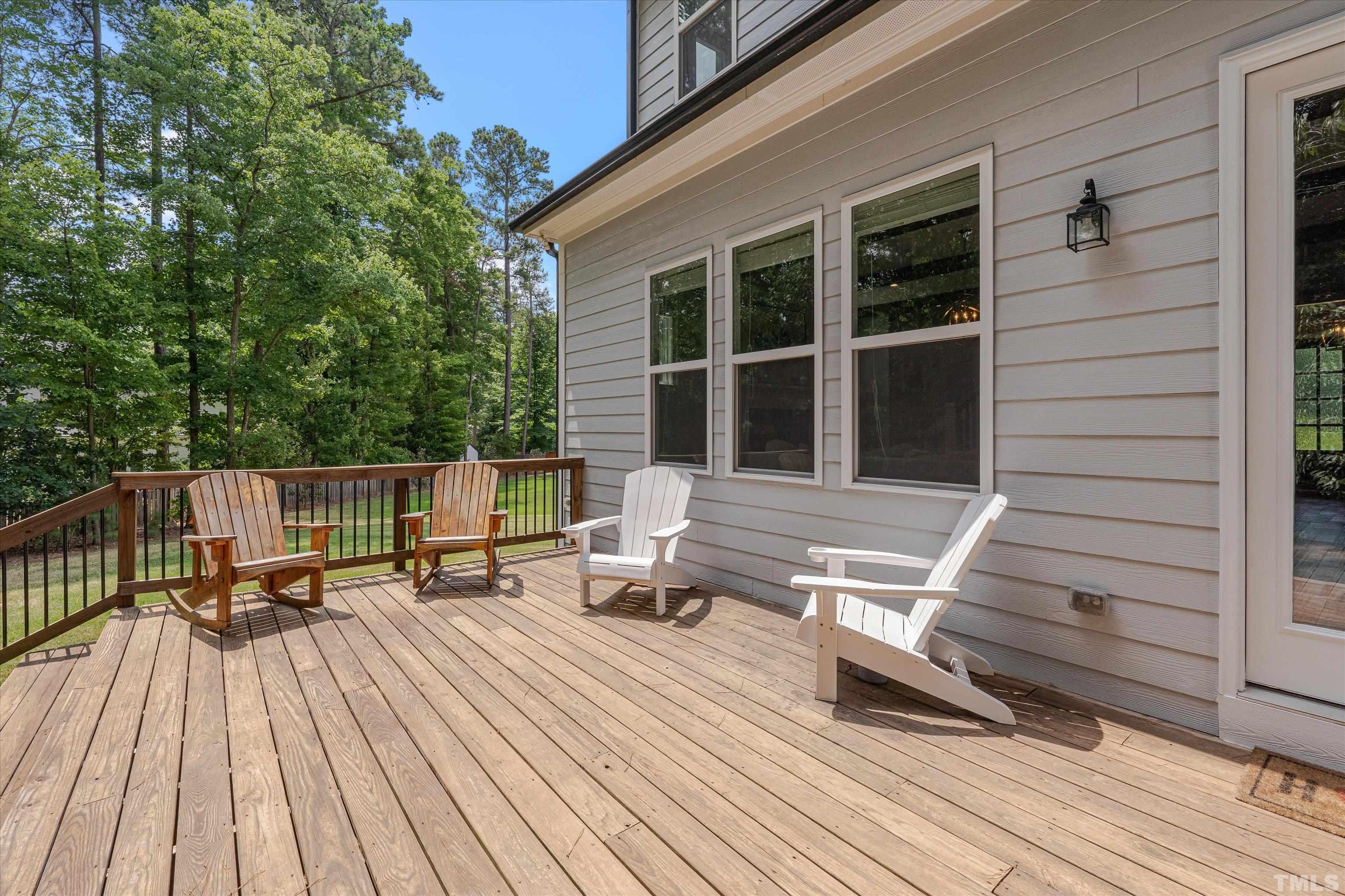 8012 Shree Court Raleigh, NC 27613 - Photo 44 of 49 a view of deck with chairs and wooden floor