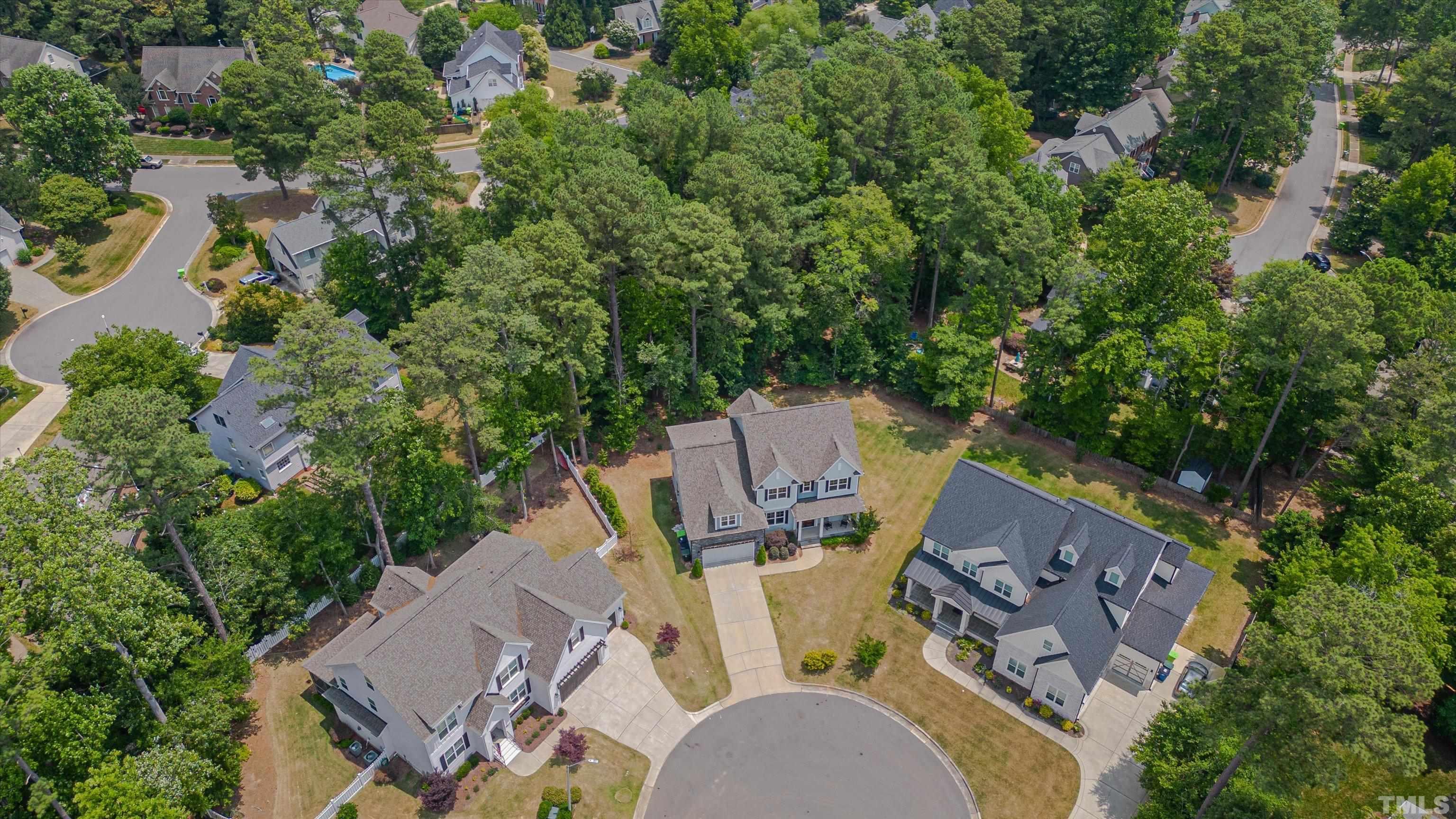 8012 Shree Court Raleigh, NC 27613 - Photo 48 of 49 an aerial view of residential house with outdoor space and trees all around