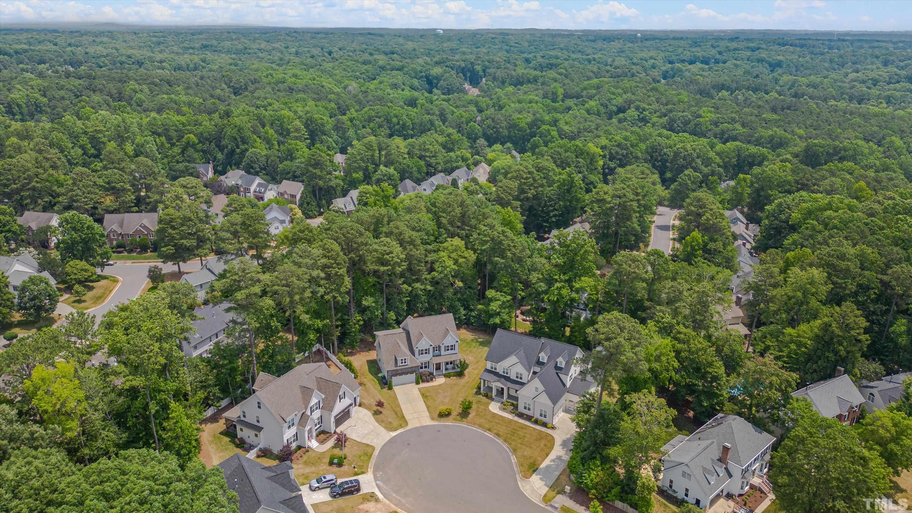 8012 Shree Court Raleigh, NC 27613 - Photo 49 of 49 an aerial view of a house with yard and outdoor seating