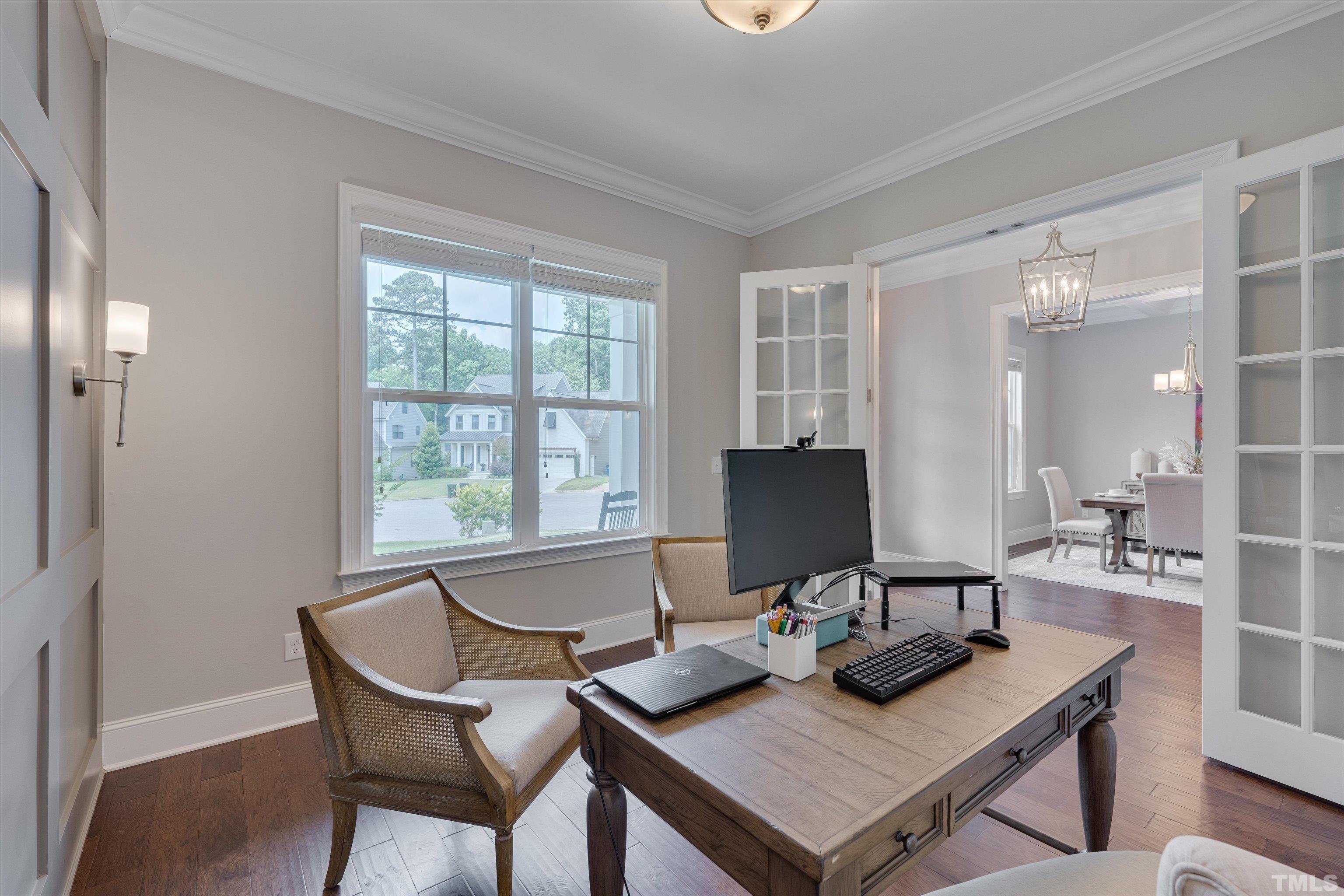 8012 Shree Court Raleigh, NC 27613 - Photo 9 of 49 a workspace with a table and chairs