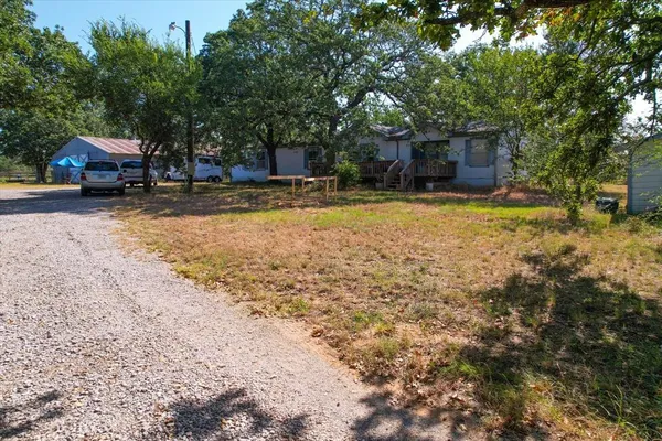 a swimming pool with outdoor seating and yard