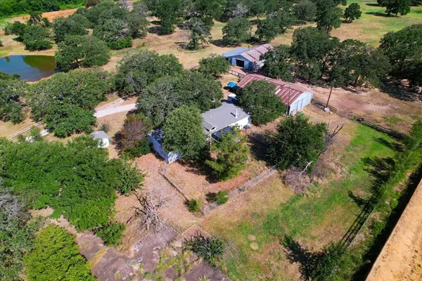 an aerial view of residential house with outdoor space
