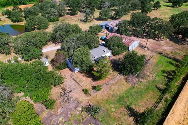 an aerial view of residential house with outdoor space