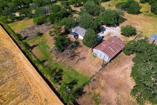 an aerial view of house with yard