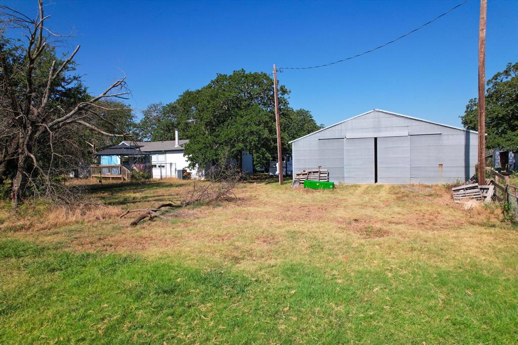 12029 Fishtrap Road Aubrey, TX 76227 - Photo 15 of 16 a view of a backyard of the house