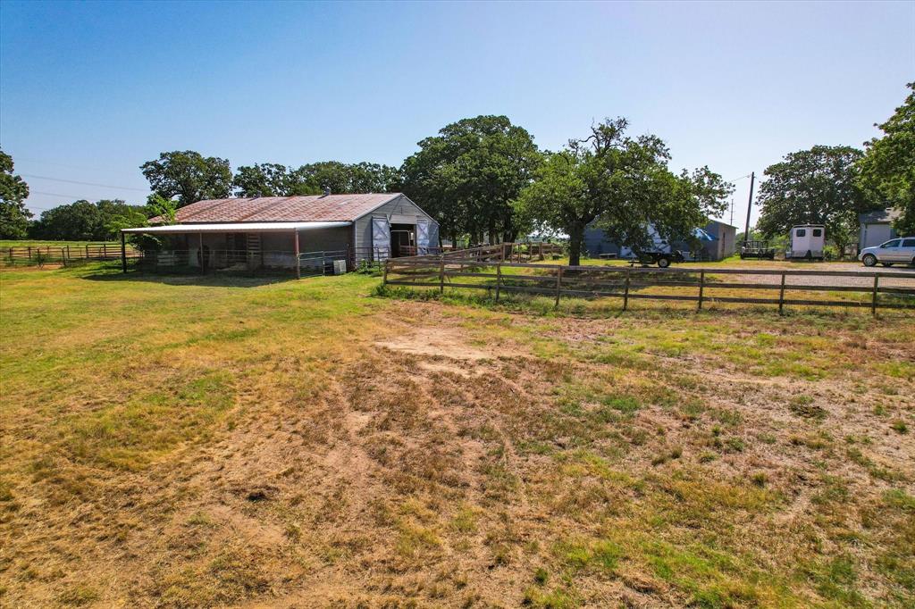 12029 Fishtrap Road Aubrey, TX 76227 - Photo 10 of 16 a view of a swimming pool with an ocean view