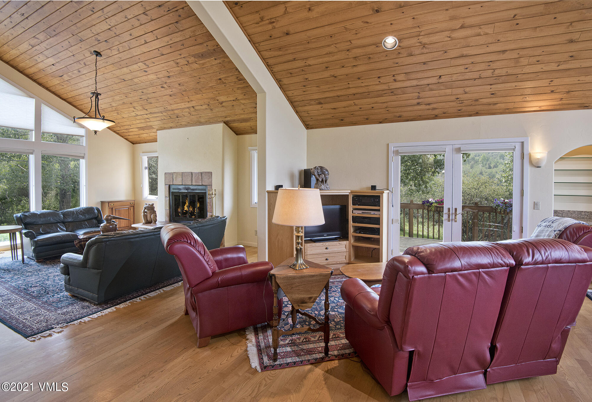 683 Eagle Crest Road Edwards, CO 81632 - Photo 12 of 47 a living room with furniture a fireplace and a large window