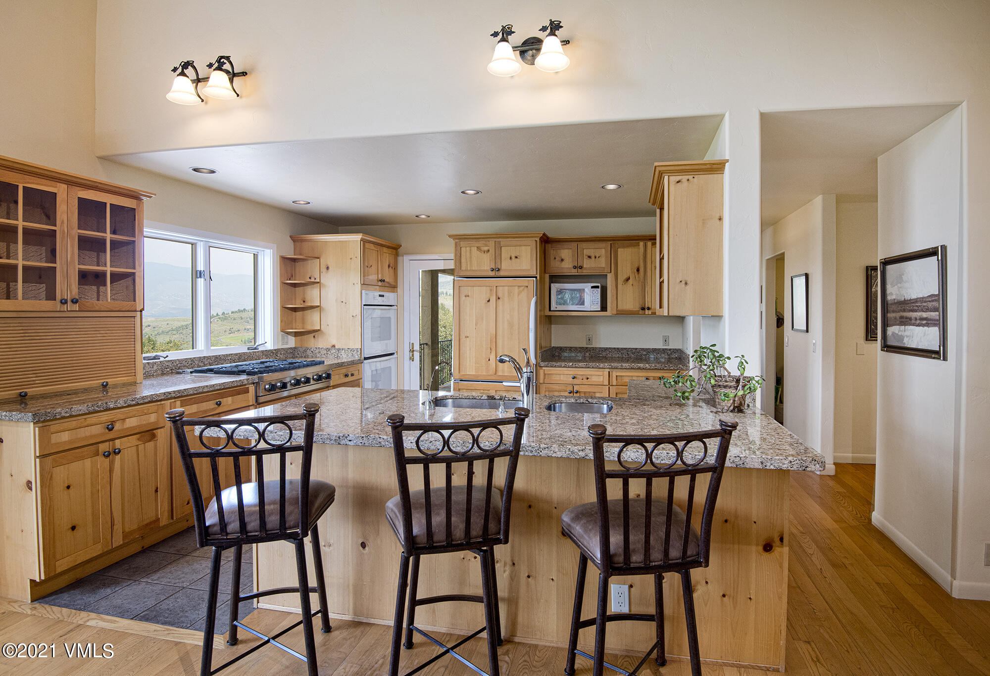 683 Eagle Crest Road Edwards, CO 81632 - Photo 15 of 47 a view of a dining room with furniture window and wooden floor