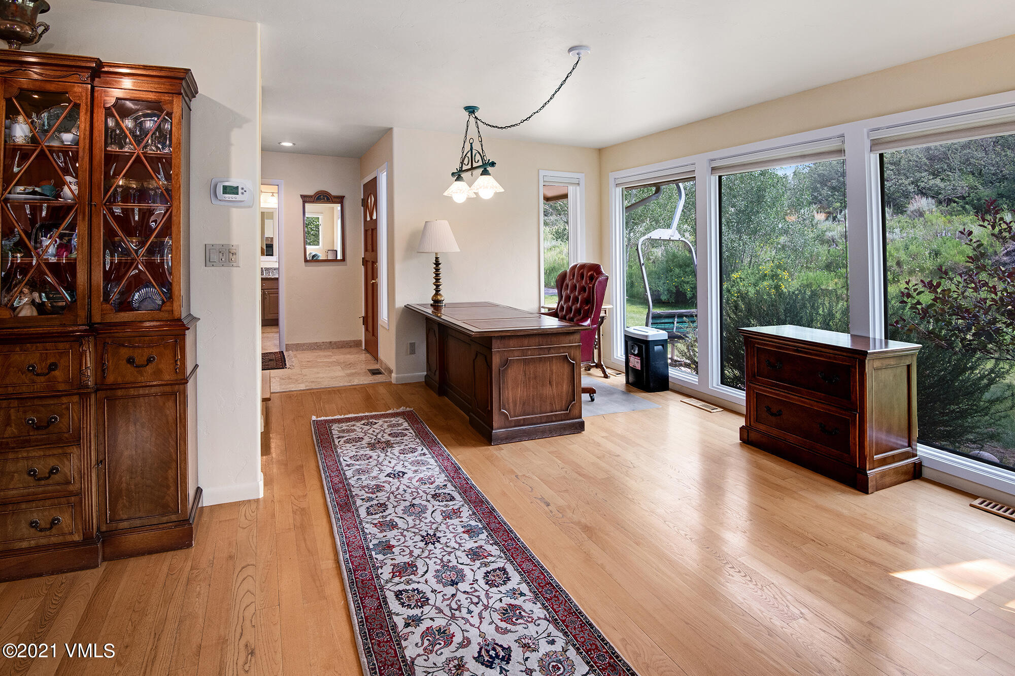 683 Eagle Crest Road Edwards, CO 81632 - Photo 20 of 47 a living room with furniture large window and wooden floor