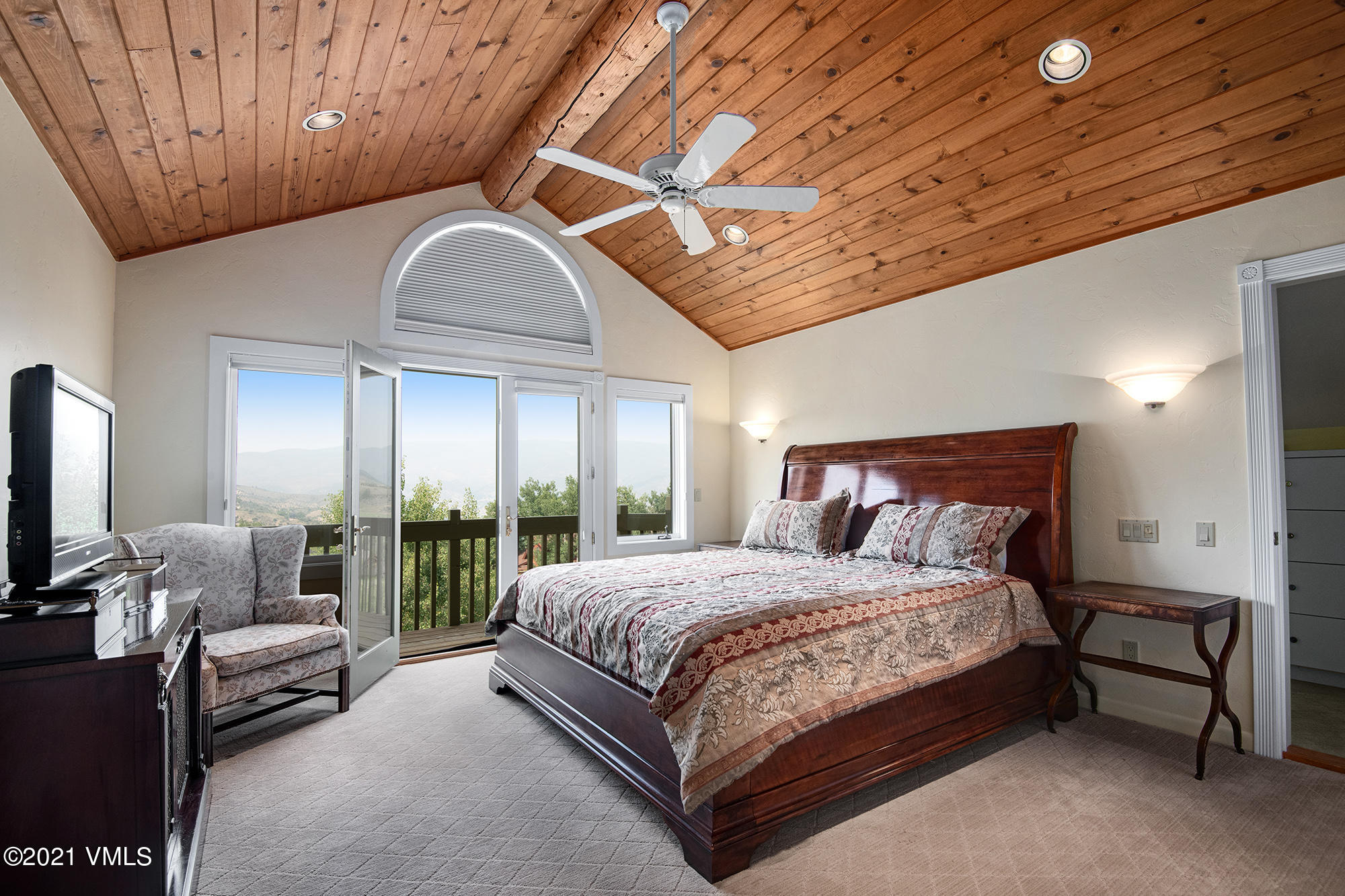 683 Eagle Crest Road Edwards, CO 81632 - Photo 28 of 47 a bedroom with a bed couch and window