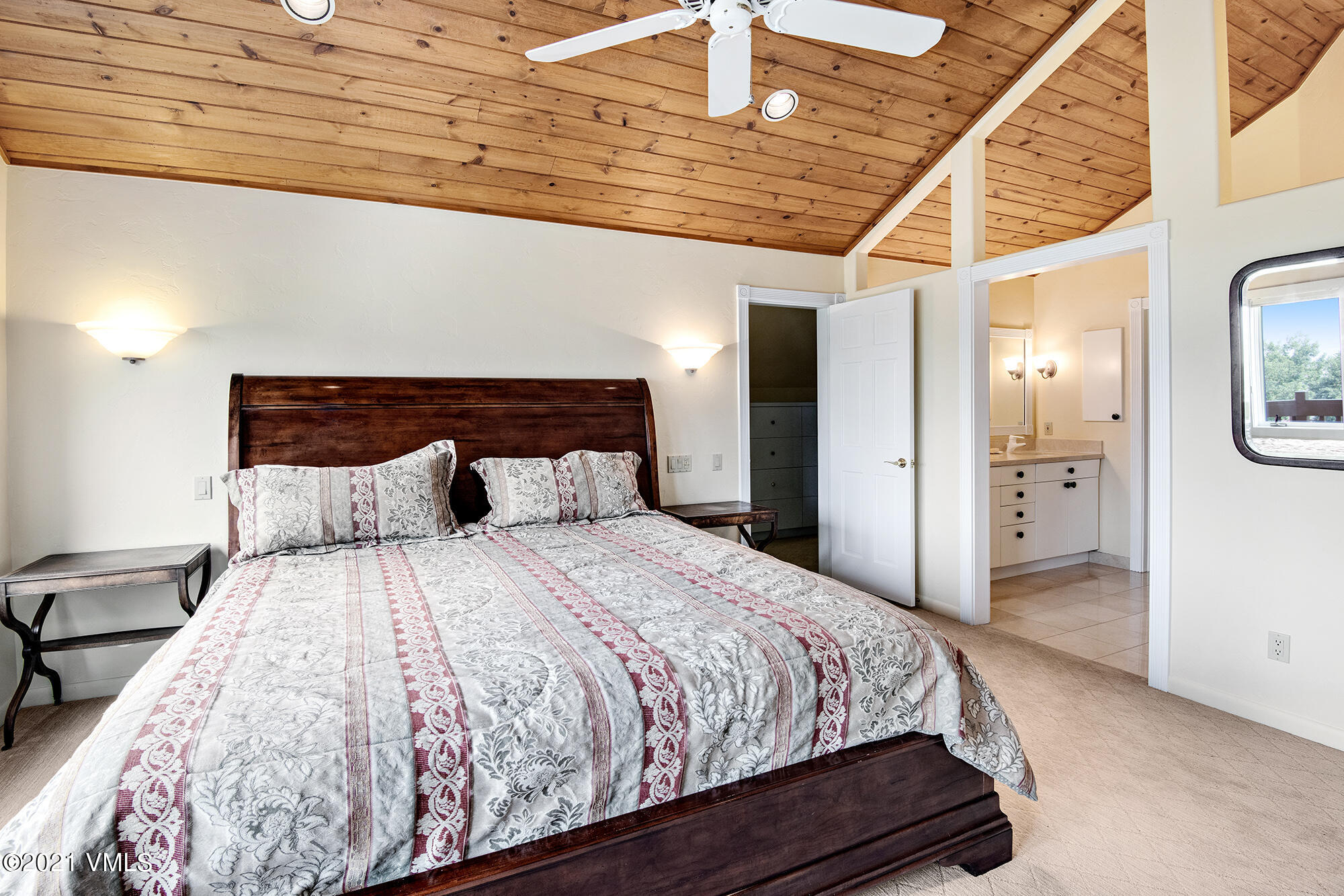 683 Eagle Crest Road Edwards, CO 81632 - Photo 29 of 47 a bedroom with a bed and a large mirror