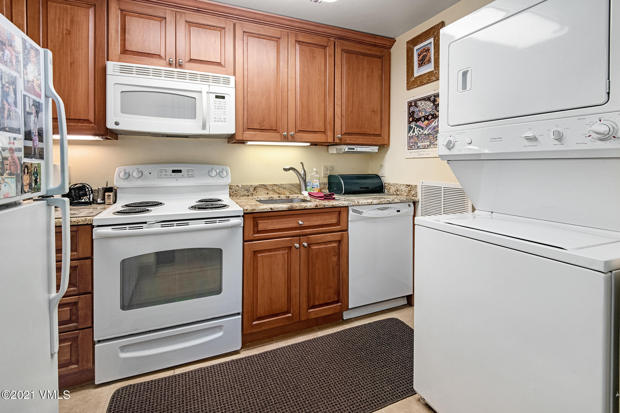 683 Eagle Crest Road Edwards, CO 81632 - Photo 36 of 47 a kitchen with granite countertop cabinets stainless steel appliances and a sink