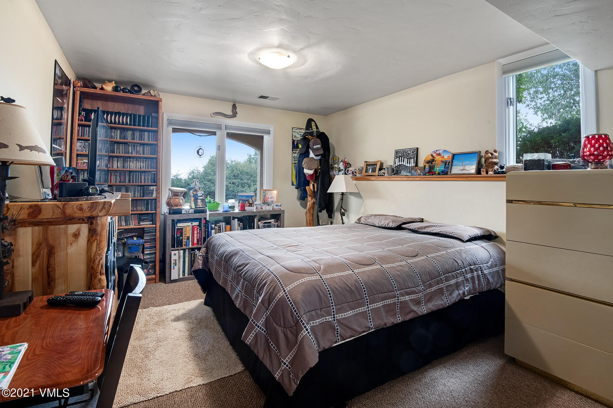 683 Eagle Crest Road Edwards, CO 81632 - Photo 38 of 47 a bed sitting in a bedroom next to a window