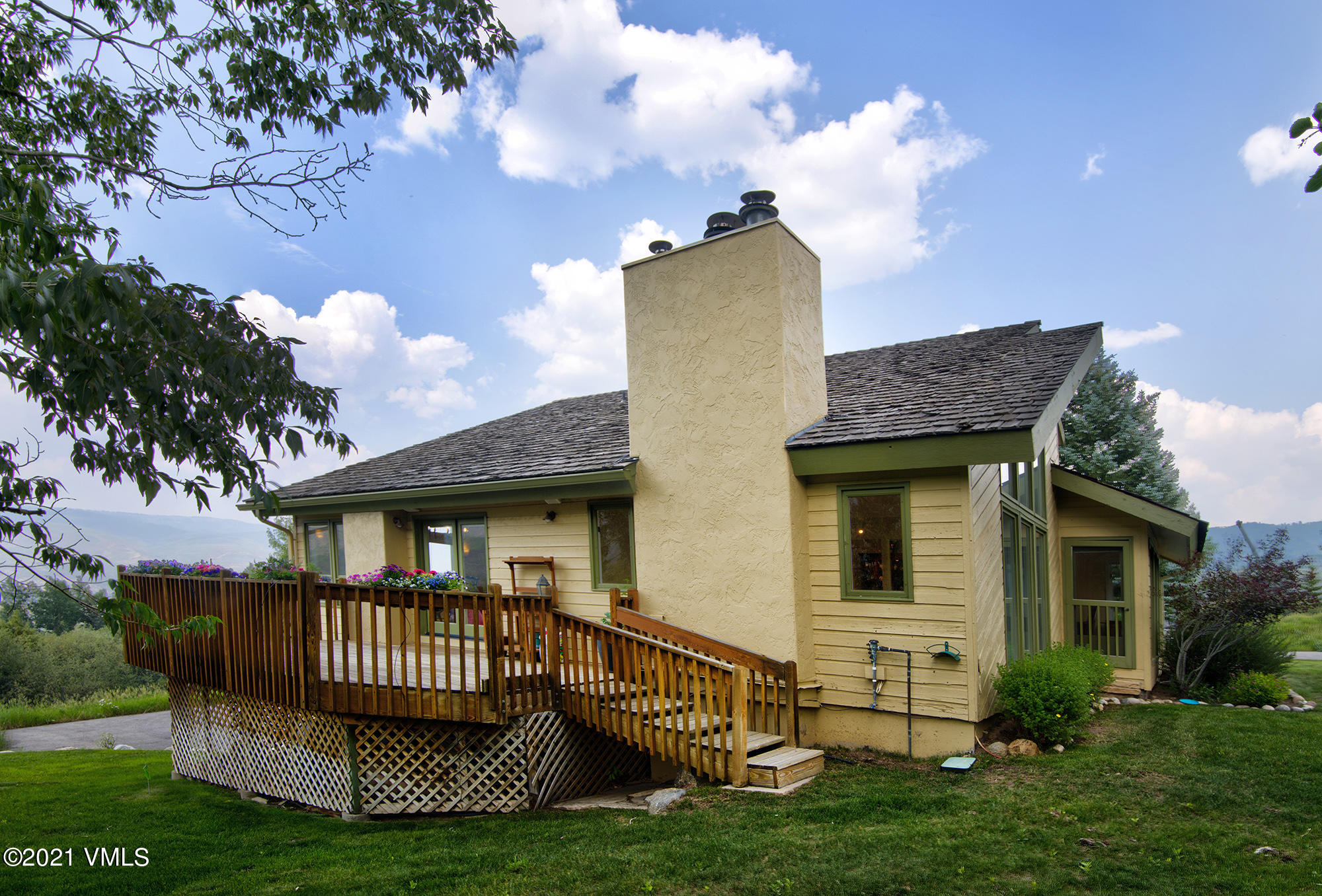 683 Eagle Crest Road Edwards, CO 81632 - Photo 5 of 47 a view of a house with a yard and deck