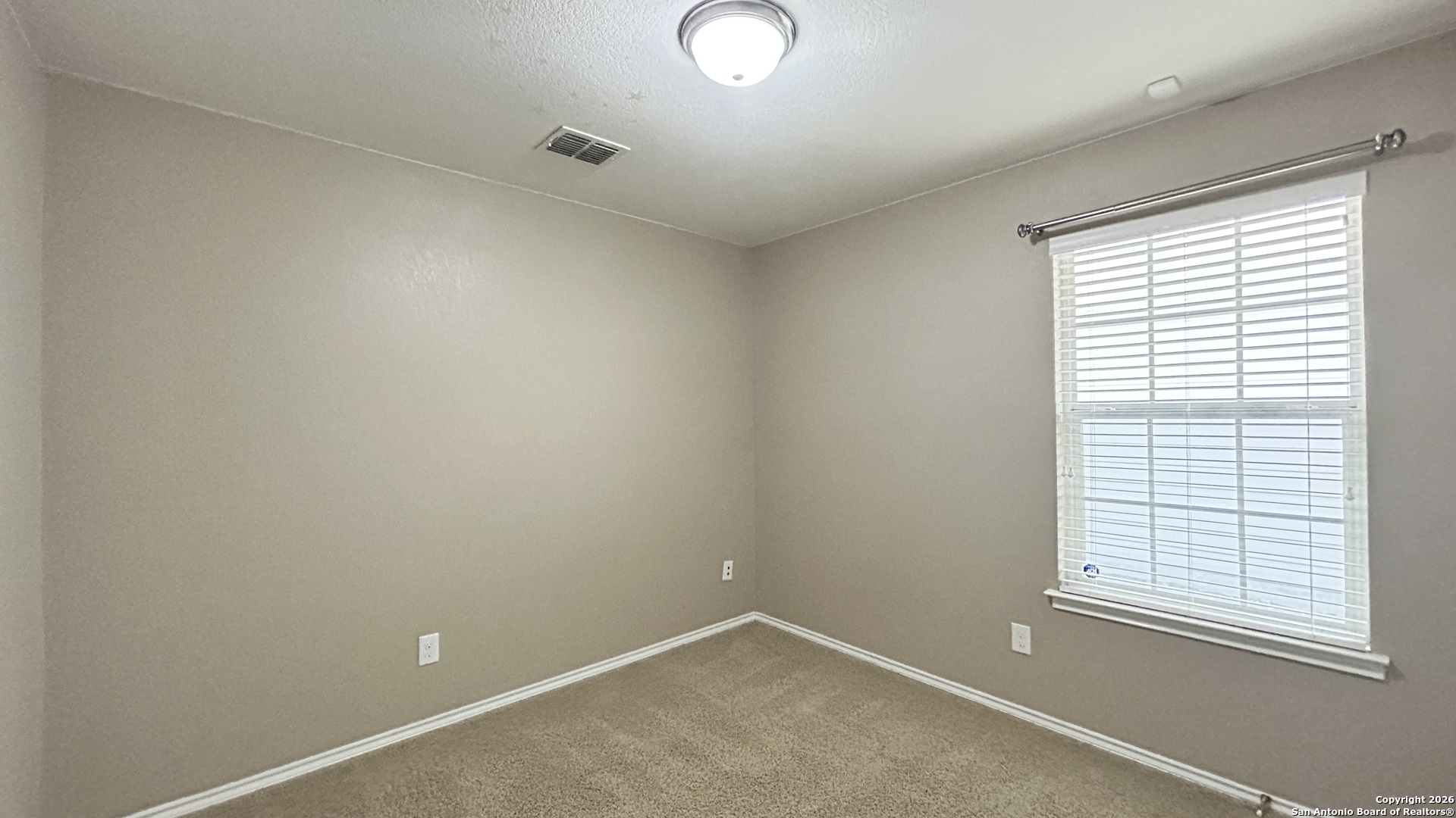 10319 Roadrunner Ridge San Antonio, TX 78245 - Photo 13 of 35 an empty room with a window