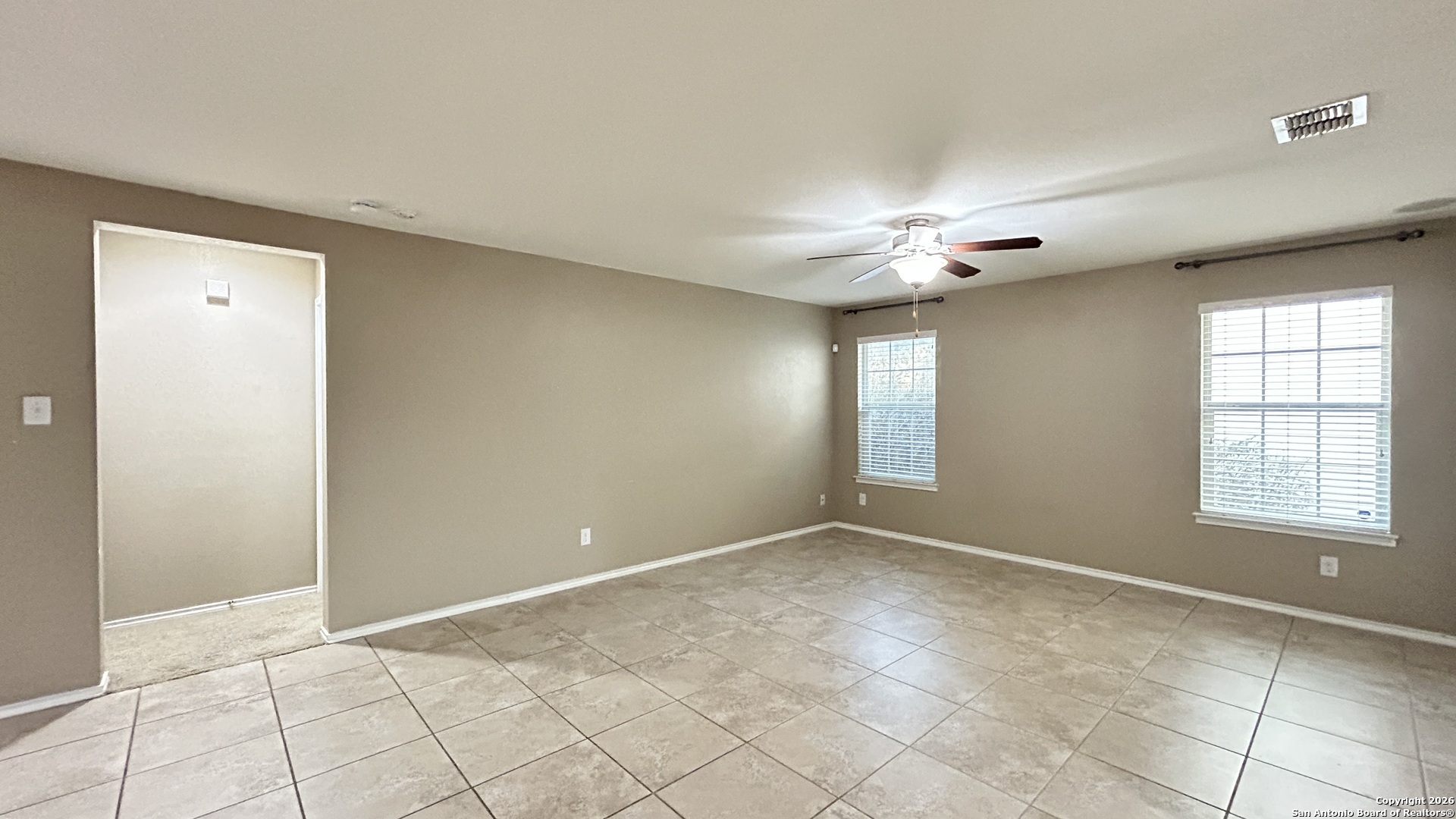 10319 Roadrunner Ridge San Antonio, TX 78245 - Photo 15 of 35 a view of an empty room with a window
