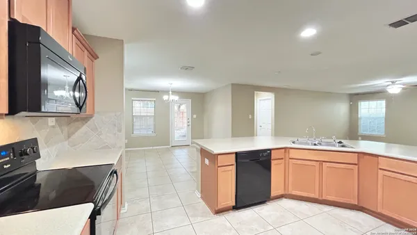a kitchen with a sink and cabinets
